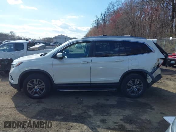 ✅ 2017 Honda Pilot EX-L • VIN: 5FNYF6H71HB061036 • Lot: 41891446. Listed on IAAI with 194,566 mi. Free auction sales archive from the USA and detailed vehicle history report at DreamBid. Image 14.