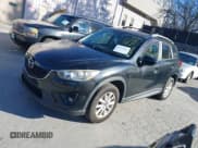 ✅ 2014 Mazda CX-5 Touring • VIN: JM3KE4CY5E0409550 • Лот: 43787833. Опубликован ранее на IAAI с пробегом 143 360 миль. Бесплатный доступ к архиву аукционных продаж из США и подробный отчёт об истории автомобиля на DreamBid. Изображение 2.