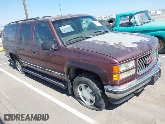 ✅ 1997 GMC Suburban • VIN: 3GKFK16R6VG513437 • Лот: 41919529. Опубликован ранее на IAAI с пробегом 357 887 миль. Бесплатный доступ к архиву аукционных продаж из США и подробный отчёт об истории автомобиля на DreamBid. Изображение 1.