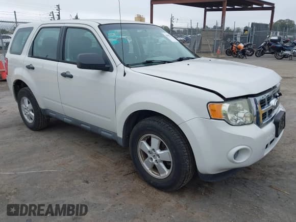 ✅ 2010 Ford Escape XLS • VIN: 1FMCU0C79AKD06626 • Lot: 43894952. Listed on IAAI with 99,581 mi. Free auction sales archive from the USA and detailed vehicle history report at DreamBid. Image 1.
