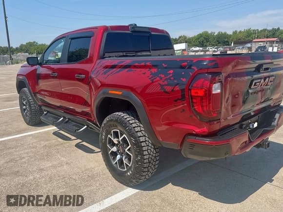 ✅ 2023 GMC Canyon 4WD AT4X • VIN: 1GTP6EEK9P1153310 • Лот: 80522335. Опубликован ранее на Copart с пробегом 11 750 миль. Бесплатный доступ к архиву аукционных продаж из США и подробный отчёт об истории автомобиля на DreamBid. Изображение 3.
