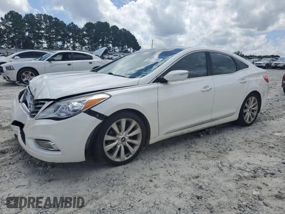 ✅ 2013 Hyundai Azera • VIN: KMHFH4JG8DA310835 • Лот: 68177595. Опубликован ранее на Copart с пробегом 165 253 миль. Бесплатный доступ к архиву аукционных продаж из США и подробный отчёт об истории автомобиля на DreamBid. Изображение 1.