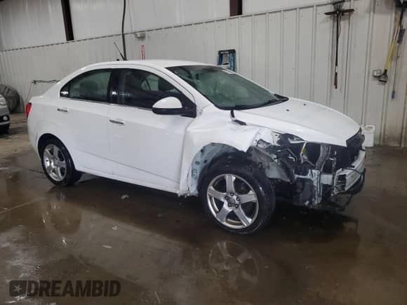 2012 Chevrolet Sonic LTZ с VIN 1G1JE5SH8C4166195, выставлен на аукционе Copart как лот 68735044 с пробегом 176 558 миль миль и Списание • Salvage title. История ставок и продаж доступна на DreamBid. Изображение 4.