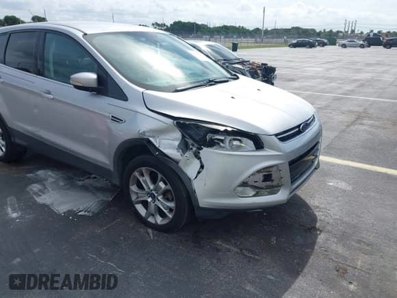 ✅ 2013 Ford Escape SEL • VIN: 1FMCU0H98DUD10959 • Lot: 43637339. Listed on IAAI with 152,762 mi. Free auction sales archive from the USA and detailed vehicle history report at DreamBid. Image 6.