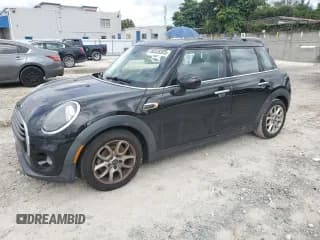 ✅ 2019 MINI Hardtop 4 Door Cooper • VIN: WMWXU1C56K2J02276 • Лот: 86538305. Опубликован ранее на Copart с пробегом 69 598 миль. Бесплатный доступ к архиву аукционных продаж из США и подробный отчёт об истории автомобиля на DreamBid. Изображение 1.