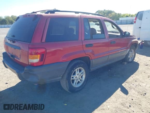 ✅ 2002 Jeep Grand Cherokee Laredo • VIN: 1J4GX48S62C257425 • Lot: 43435617. Listed on IAAI with 251,435 mi. Free auction sales archive from the USA and detailed vehicle history report at DreamBid. Image 4.