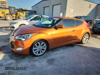 2015 Hyundai Veloster z VIN KMHTC6AD3FU219198, wystawiony jako Copart lot #81516035 z przebiegiem 77 510 mil mil oraz Szkoda całkowita • Salvage title. Historia ofert i sprzedaży dostępna na DreamBid. Obrazek 1.