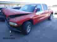 2000 Dodge Dakota Sport z VIN 1B7GL2AZ4YS722151, wystawiony jako Copart lot #87870705 z przebiegiem 169 435 mil mil oraz Szkoda całkowita • Salvage title. Historia ofert i sprzedaży dostępna na DreamBid. Obrazek 1.
