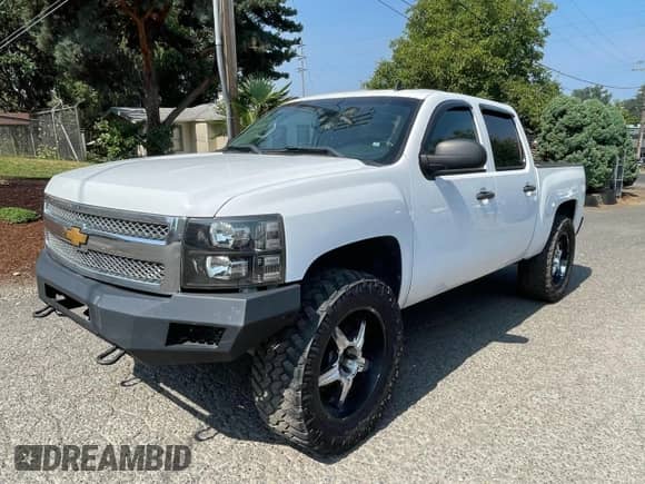 2013 Chevrolet Silverado 1500 LT с VIN 3GCPKSE71DG102953, выставлен на аукционе Copart как лот 70785265 с пробегом 169 616 миль миль и Списание • Salvage title. История ставок и продаж доступна на DreamBid. Изображение 2.