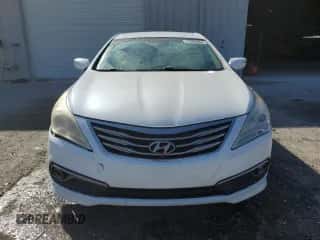 2015 Hyundai Azera z VIN KMHFG4JG7FA479119, wystawiony jako Copart lot #77689064 z przebiegiem 230 075 mil mil oraz Szkoda całkowita • Salvage title. Historia ofert i sprzedaży dostępna na DreamBid. Obrazek 5.
