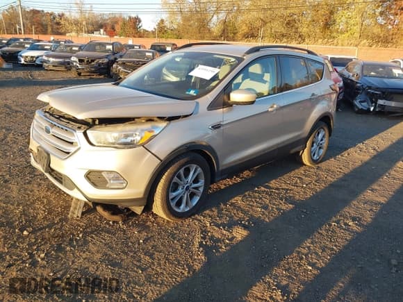 ✅ 2018 Ford Escape SE • VIN: 1FMCU0GD5JUA93856 • Lot: 43591250. Listed on IAAI with 51,272 mi. Free auction sales archive from the USA and detailed vehicle history report at DreamBid. Image 18.