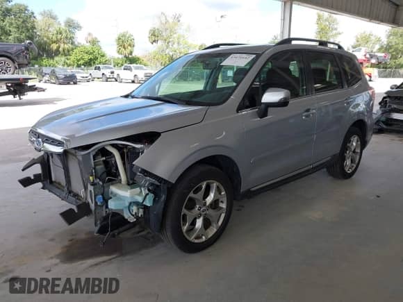 2017 Subaru Forester Touring z VIN JF2SJAWC7HH555670, wystawiony jako IAAI lot #43471642 z przebiegiem 89 476 mil mil oraz . Historia ofert i sprzedaży dostępna na DreamBid. Obrazek 2.