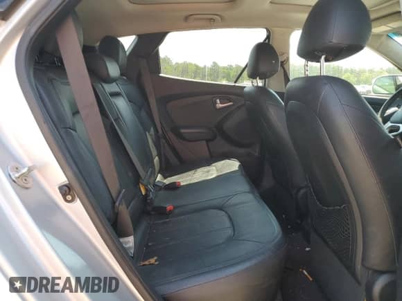 2013 Hyundai Tucson Limited z VIN KM8JUCAC9DU557664, wystawiony jako Copart lot #53707934 z przebiegiem 148 967 mil mil oraz Szkoda całkowita • Salvage title. Historia ofert i sprzedaży dostępna na DreamBid. Obrazek 11.