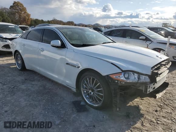 ✅ 2014 Jaguar XJ Portfolio • VIN: SAJWA2GZ0E8V60926 • Lot: 91886025. Listed on Copart with 76,911 mi. Free auction sales archive from the USA and detailed vehicle history report at DreamBid. Image 4.