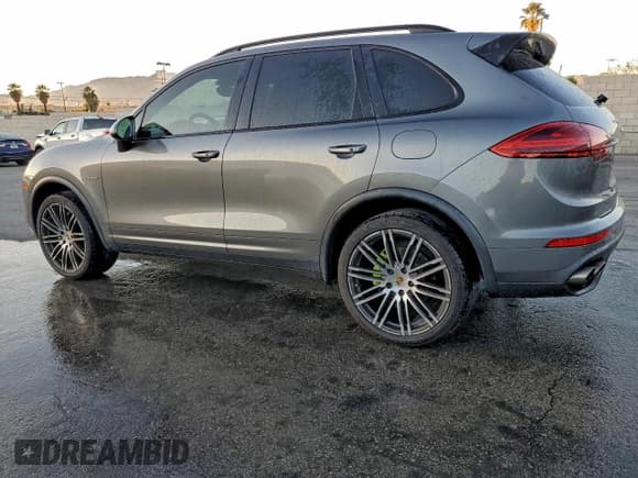 ✅ 2016 Porsche Cayenne S E-Hybrid • VIN: WP1AE2A23GLA17786 • Lot: 95221045. Listed on Copart with 134,959 mi. Free auction sales archive from the USA and detailed vehicle history report at DreamBid. Image 2.