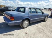✅ 1993 Dodge Spirit • VIN: 1B3XA46K0PF638477 • Lot: 75710534. Listed on Copart with 50,637 mi. Free auction sales archive from the USA and detailed vehicle history report at DreamBid. Image 3.