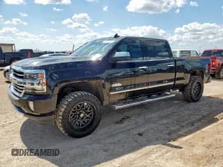 ✅ 2018 Chevrolet Silverado 1500 High Country • VIN: 3GCUKTEC7JG215906 • Лот: 63675725. Опубликован ранее на Copart с пробегом 104 345 миль. Бесплатный доступ к архиву аукционных продаж из США и подробный отчёт об истории автомобиля на DreamBid. Изображение 1.