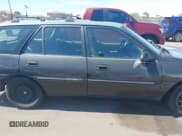 ✅ 1998 Ford Escort SE • VIN: 3FAFP15P0WR238401 • Lot: 43273047. Wystawiony na IAAI z przebiegiem 115 829 mil. Bezpłatny archiwum sprzedaży aukcyjnych z USA i szczegółowy raport historii pojazdu na DreamBid. Zdjęcie 13.