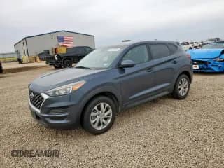 2019 Hyundai Tucson SE z VIN KM8J2CA4XKU937849, wystawiony jako Copart lot #91281325 z przebiegiem 106 973 mil mil oraz Czysty tytuł • Clean title. Historia ofert i sprzedaży dostępna na DreamBid. Obrazek 1.