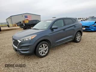 ✅ 2019 Hyundai Tucson SE • VIN: KM8J2CA4XKU937849 • Лот: 91281325. Опубликован ранее на Copart с пробегом 106 973 миль. Бесплатный доступ к архиву аукционных продаж из США и подробный отчёт об истории автомобиля на DreamBid. Изображение 1.