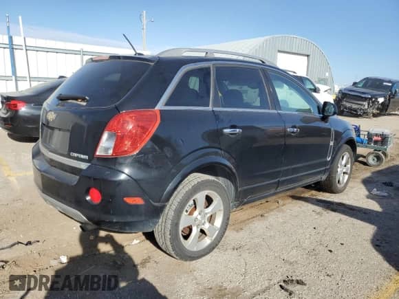 2015 Chevrolet Captiva Sport LT z VIN 3GNAL3EK4FS511548, wystawiony jako Copart lot #84188124 z przebiegiem 275 071 mil mil oraz Czysty tytuł • Clean title. Historia ofert i sprzedaży dostępna na DreamBid. Obrazek 3.