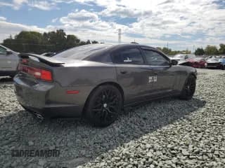 ✅ 2014 Dodge Charger RT • VIN: 2C3CDXCT1EH370154 • Лот: 80934955. Опубликован ранее на Copart с пробегом 124 401 миль. Бесплатный доступ к архиву аукционных продаж из США и подробный отчёт об истории автомобиля на DreamBid. Изображение 3.