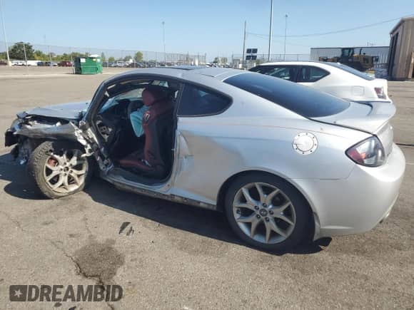 2008 Hyundai Tiburon GT z VIN KMHHN66F08U267030, wystawiony jako Copart lot #67479764 z przebiegiem Nie podano mil oraz Szkoda całkowita • Salvage title. Historia ofert i sprzedaży dostępna na DreamBid. Obrazek 2.