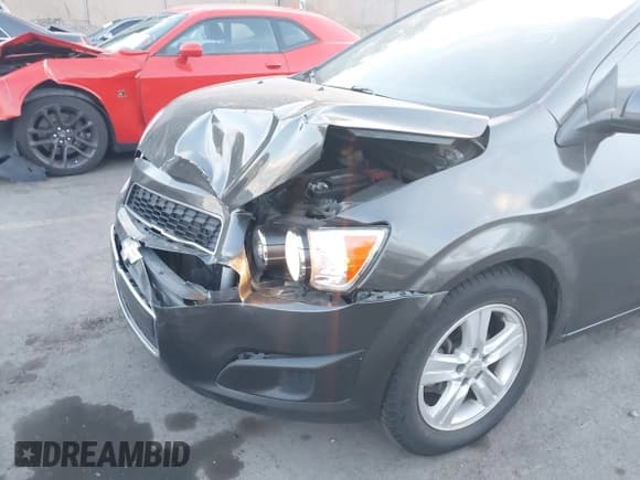 ✅ 2014 Chevrolet Sonic LT • VIN: 1G1JC5SH7E4167993 • Lot: 43055510. Listed on IAAI with 115,256 mi. Free auction sales archive from the USA and detailed vehicle history report at DreamBid. Image 6.