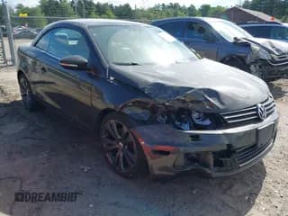 ✅ 2013 Volkswagen Eos Executive • VIN: WVWFW8AH0DV009334 • Lot: 42556487. Listed on IAAI with 83,435 mi. Free auction sales archive from the USA and detailed vehicle history report at DreamBid. Image 1.