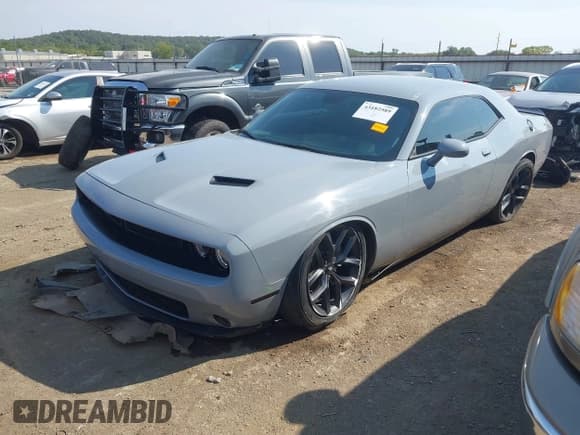 ✅ 2022 Dodge Challenger SXT • VIN: 2C3CDZAG8NH137597 • Lot: 43182589. Listed on IAAI with 39,666 mi. Free auction sales archive from the USA and detailed vehicle history report at DreamBid. Image 2.