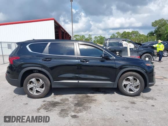 ✅ 2021 Hyundai Santa Fe SE • VIN: 5NMS14AJ0MH332918 • Lot: 42365534. Listed on IAAI with 58,720 mi. Free auction sales archive from the USA and detailed vehicle history report at DreamBid. Image 13.