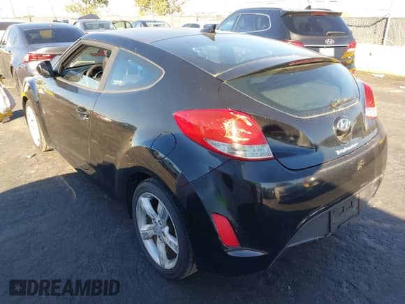 2012 Hyundai Veloster w/Red Int with VIN KMHTC6AD2CU029761, listed as a IAAI auction lot 43603146 with 64,357 mi miles and . Bid and sale history available at DreamBid. Image 3.