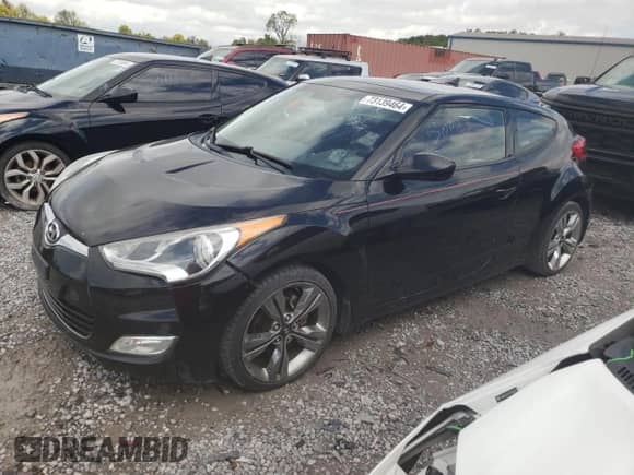 2012 Hyundai Veloster w/Red Int z VIN KMHTC6AD6CU026250, wystawiony jako Copart lot #73139464 z przebiegiem 215 374 mil mil oraz Czysty tytuł • Clean title. Historia ofert i sprzedaży dostępna na DreamBid. Obrazek 1.