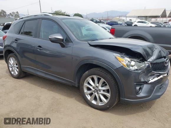 ✅ 2015 Mazda CX-5 Grand Touring • VIN: JM3KE4DY9F0466141 • Lot: 43106230. Listed on IAAI with 130,866 mi. Free auction sales archive from the USA and detailed vehicle history report at DreamBid. Image 1.