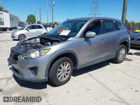 ✅ 2015 Mazda CX-5 Sport • VIN: JM3KE2BEXF0527431 • Lot: 41832024. Listed on IAAI with 131,215 mi. Free auction sales archive from the USA and detailed vehicle history report at DreamBid. Image 17.