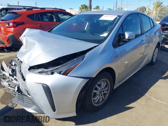 ✅ 2021 Toyota Prius L Eco • VIN: JTDKAMFU1M3152056 • Lot: 43657997. Listed on IAAI with 83,328 mi. Free auction sales archive from the USA and detailed vehicle history report at DreamBid. Image 2.