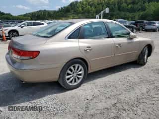 2007 Hyundai Azera SE z VIN KMHFC46F57A179561, wystawiony jako Copart lot #65562574 z przebiegiem 161 939 mil mil oraz Szkoda całkowita • Salvage title. Historia ofert i sprzedaży dostępna na DreamBid. Obrazek 3.