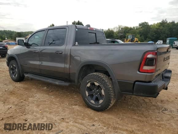 2020 Ram 1500 Rebel z VIN 1C6SRFLT2LN179065, wystawiony jako Copart lot #81848595 z przebiegiem 113 063 mil mil oraz Szkoda całkowita • Salvage title. Historia ofert i sprzedaży dostępna na DreamBid. Obrazek 2.