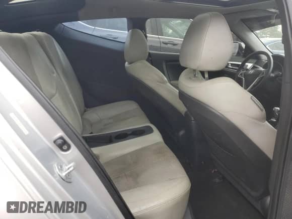 2012 Hyundai Veloster w/Red Int z VIN KMHTC6AD2CU021143, wystawiony jako Copart lot #44055345 z przebiegiem Nie podano mil oraz Czysty tytuł • Clean title. Historia ofert i sprzedaży dostępna na DreamBid. Obrazek 10.