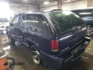 2005 Chevrolet Blazer with VIN 1GNCS18X65K101710, listed as a Copart auction lot 76982844 with 129,988 mi miles and Salvage title. Bid and sale history available at DreamBid. Image 2.