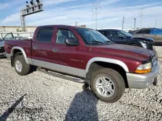 2002 Dodge Dakota SLT с VIN 1B7HG48N92S659160, выставлен на аукционе Copart как лот 79810184 с пробегом 145 405 миль миль и Списание • Salvage title. История ставок и продаж доступна на DreamBid. Изображение 4.