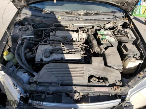 ✅ 2000 Mazda Protege DX • VIN: JM1BJ2220Y0239835 • Lot: 80228864. Wystawiony na Copart z przebiegiem 200 936 mil. Bezpłatny archiwum sprzedaży aukcyjnych z USA i szczegółowy raport historii pojazdu na DreamBid. Zdjęcie 11.