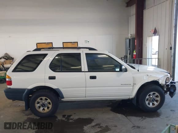 ✅ 1999 Isuzu Rodeo S • VIN: 4S2CM58W1X4361445 • Lot: 42823378. Listed on IAAI with 193,119 mi. Free auction sales archive from the USA and detailed vehicle history report at DreamBid. Image 12.
