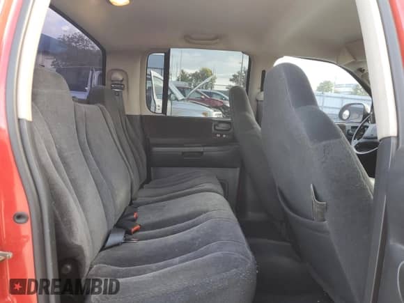 2003 Dodge Dakota SLT с VIN 1D7HG48NX3S345590, выставлен на аукционе Copart как лот 70002875 с пробегом 437 659 миль миль и Чистый • Clean title. История ставок и продаж доступна на DreamBid. Изображение 10.