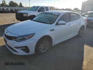 ✅ 2019 Kia Optima LX • VIN: 5XXGT4L36KG306494 • Лот: 85364175. Опубликован ранее на Copart с пробегом 169 021 миль. Бесплатный доступ к архиву аукционных продаж из США и подробный отчёт об истории автомобиля на DreamBid. Изображение 1.