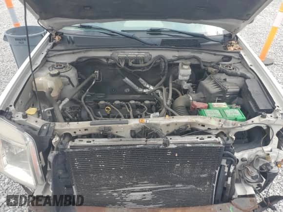 2011 Mercury Mariner z VIN 4M2CN8B71BKJ01749, wystawiony jako Copart lot #64199345 z przebiegiem 157 001 mil mil oraz Szkoda całkowita • Salvage title. Historia ofert i sprzedaży dostępna na DreamBid. Obrazek 12.