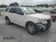 2011 Mercury Mariner z VIN 4M2CN8B71BKJ01749, wystawiony jako Copart lot #64199345 z przebiegiem 157 001 mil mil oraz Szkoda całkowita • Salvage title. Historia ofert i sprzedaży dostępna na DreamBid. Obrazek 4.