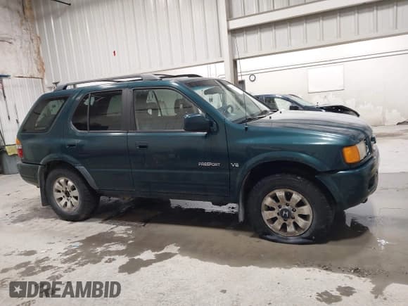 ✅ 1998 Honda Passport LX • VIN: 4S6CM58W9W4419797 • Lot: 42425697. Listed on IAAI with 158,562 mi. Free auction sales archive from the USA and detailed vehicle history report at DreamBid. Image 13.