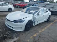 ✅ 2023 Tesla Model S Plaid • VIN: 5YJSA1E63PF521945 • Lot: 43248046. Listed on IAAI with 26,327 mi. Free auction sales archive from the USA and detailed vehicle history report at DreamBid. Image 2.
