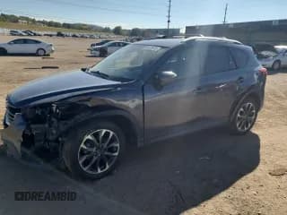 ✅ 2016 Mazda CX-5 Grand Touring • VIN: JM3KE4DY0G0816824 • Lot: 86678915. Listed on Copart with 120,570 mi. Free auction sales archive from the USA and detailed vehicle history report at DreamBid. Image 1.